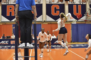 A Syracuse player jumps up for a hit. The Orange won the first set 25-23.